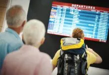 1140 couple looking at departure board esp