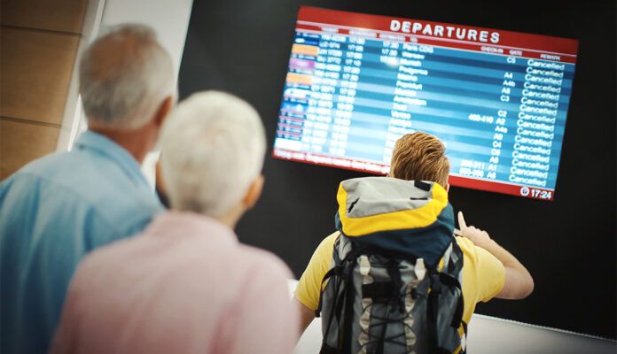 1140 couple looking at departure board esp