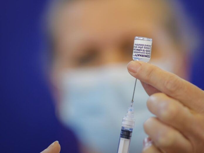 healthcare workers and people aged over 75 receive first dose of pfizer biontech vaccine 1